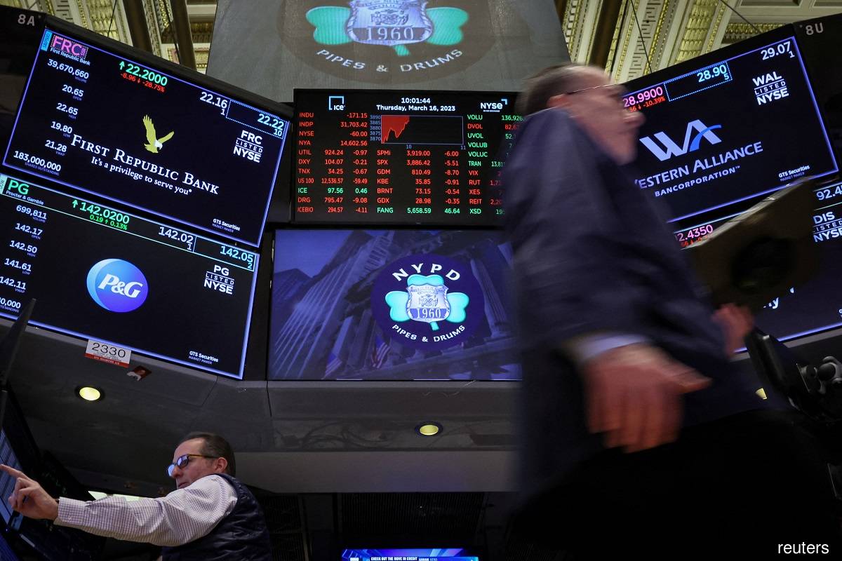 Traders work at the post where First Republic Bank stock is traded on the floor of the New York Stock Exchange in New York City March 16, 2023. (Reuters pic)